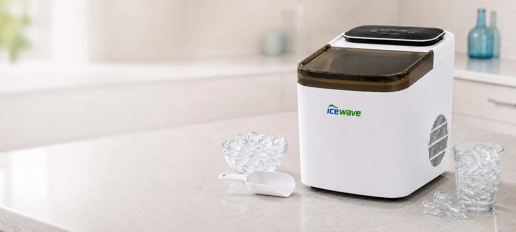 ZB-13 countertop ice maker on bright kitchen counter with bowl of fresh bullet ice, ice scoop, and a glass of ice — fast bullet ice for every drink at home.